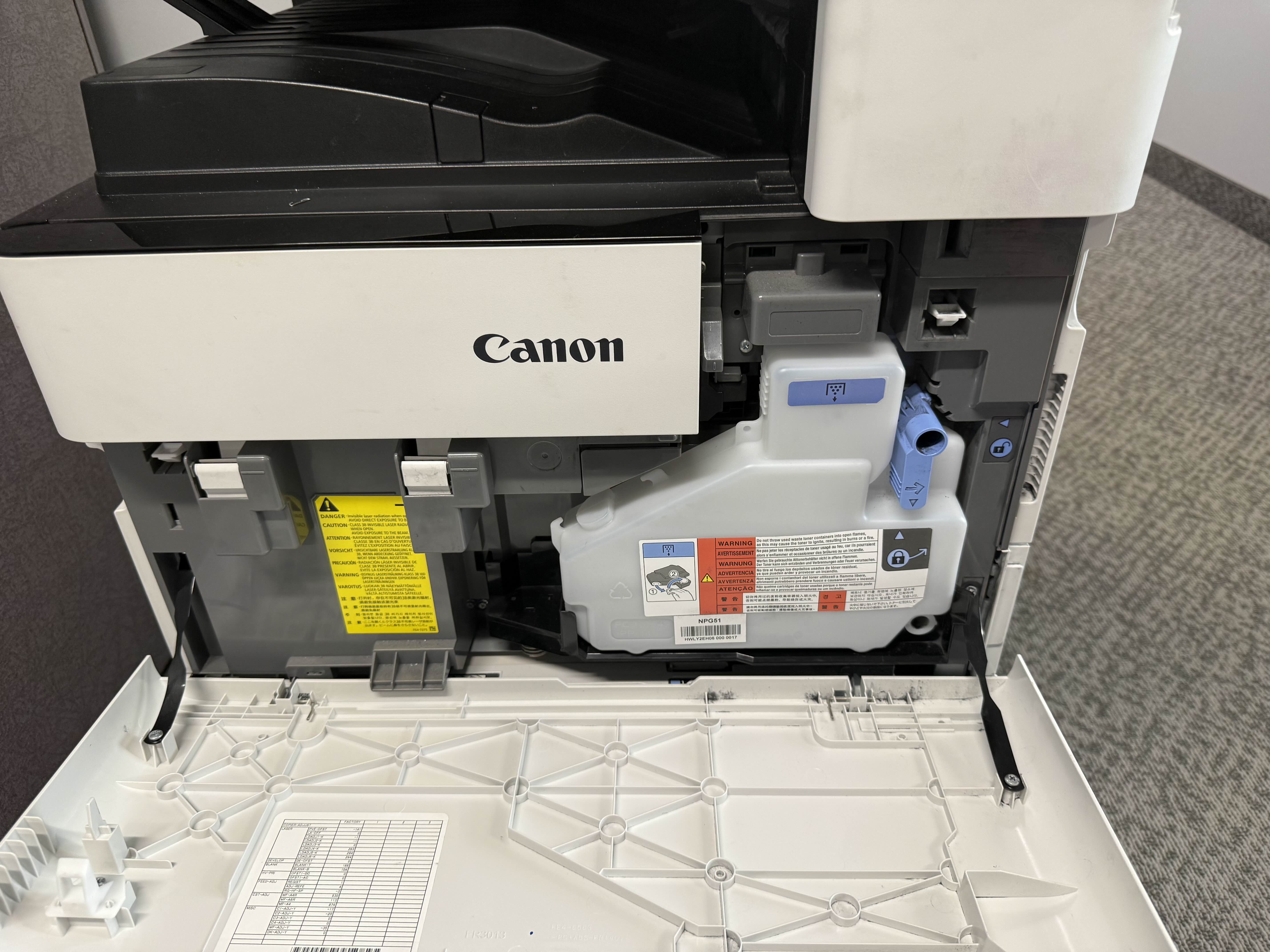Canon imageRUNNER ADVANCE 4535i front panel open showing waste toner bottle during on-site service