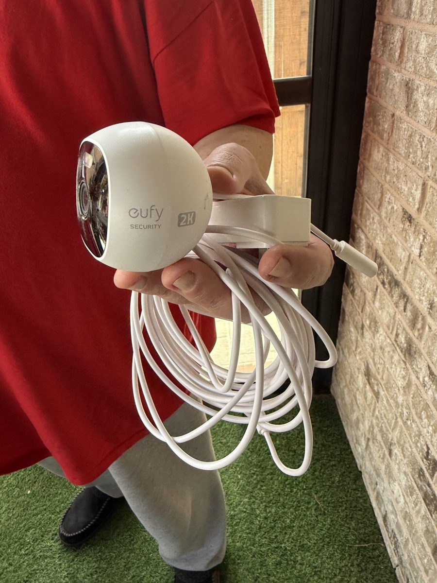 Customer-supplied Eufy 2K wired security camera ready for installation at a DFW brick home