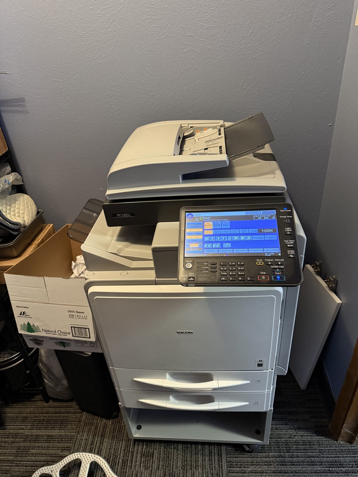 Office copier serviced on site for a paper-feed problem that pulled two pages at once